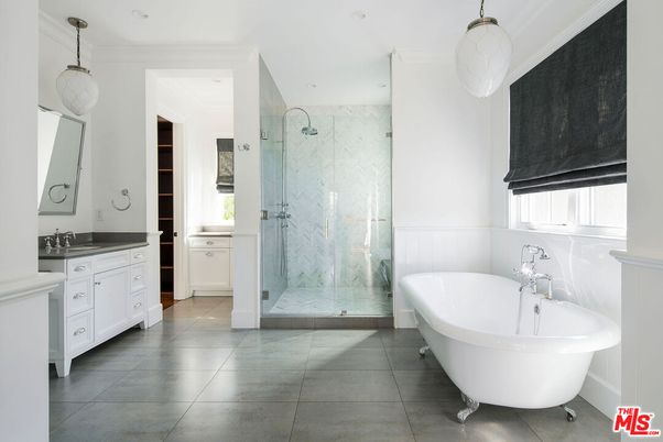 Bathroom, Dual Sink Vanities, Free Standing Baths, Glass Shower, Interior, Marble Walls, Pendant Lights, Recessed Lighting
