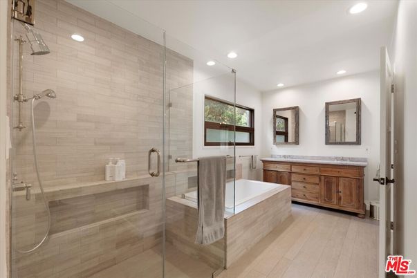 Bathroom, Dual Sink Vanities, Glass Shower, Interior, Recessed Lighting, Wood Texture Flooring