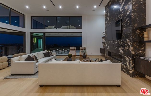 Fireplace, Interior, Living room, Marble Walls, Recessed Lighting, Wood Texture Flooring