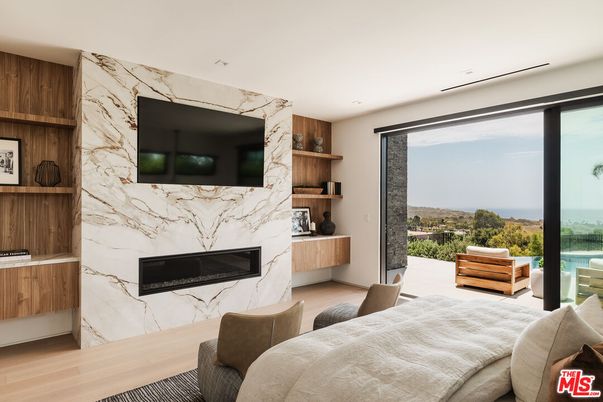 Bedroom, Fireplace, Interior, Marble Walls, Recessed Lighting, Water, Wood Texture Flooring
