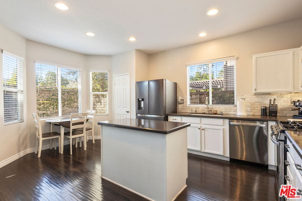 Dining room, Interior, Kitchen, Recessed Lighting, Stainless Steel Appliances, Wood Texture Flooring