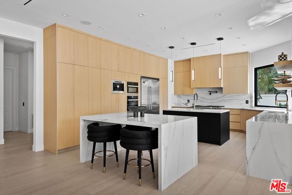 Interior, Kitchen, Marble Walls, Pendant Lights, Recessed Lighting, Stainless Steel Appliances, Wood Texture Flooring