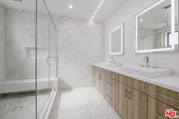Bathroom, Dual Sink Vanities, Glass Shower, Interior, Marble, Marble Walls, Recessed Lighting