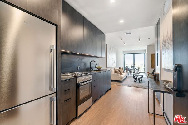 Dining room, Interior, Kitchen, Living room, Recessed Lighting, Stainless Steel Appliances, Wood Texture Flooring