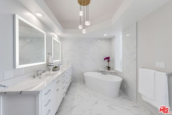 Bathroom, Dual Sink Vanities, Free Standing Baths, Interior, Marble, Marble Walls, Pendant Lights, Recessed Lighting