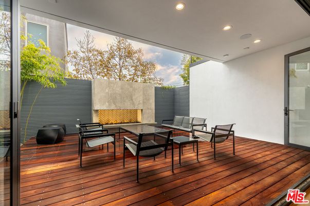 Exterior, Fireplace, Wood Texture Flooring