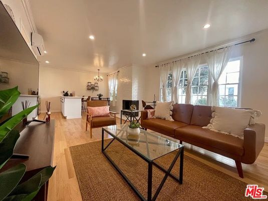 Chandelier, Dining room, Fireplace, Interior, Living room, Recessed Lighting, Wood Texture Flooring