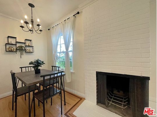 Chandelier, Dining room, Fireplace, Interior, Stone Walls, Wood Texture Flooring