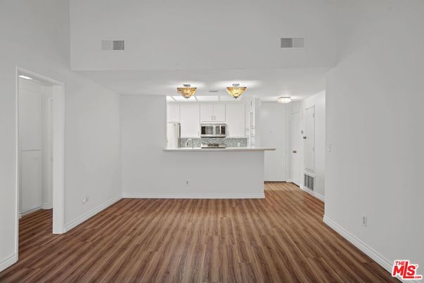 Empty room, Interior, Kitchen, Stainless Steel Appliances, Wood Texture Flooring