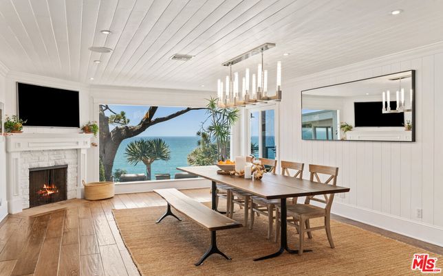 Dining room, Fireplace, Interior, Pendant Lights, Recessed Lighting, Water, Wood Texture Flooring