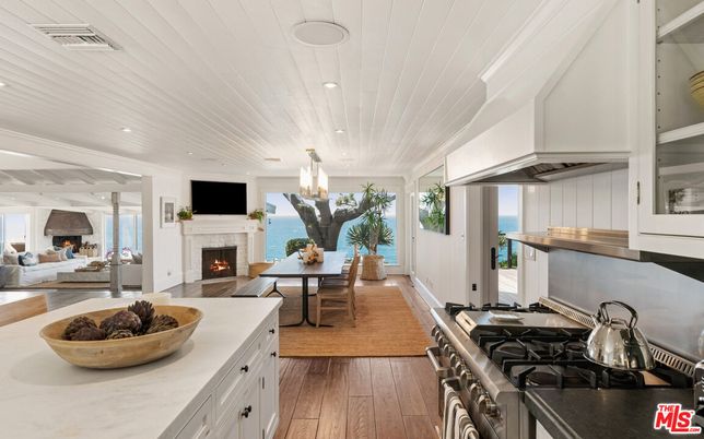 Dining room, Fireplace, Interior, Kitchen, Living room, Pendant Lights, Recessed Lighting, Stainless Steel Appliances, Water, Wood Texture Flooring