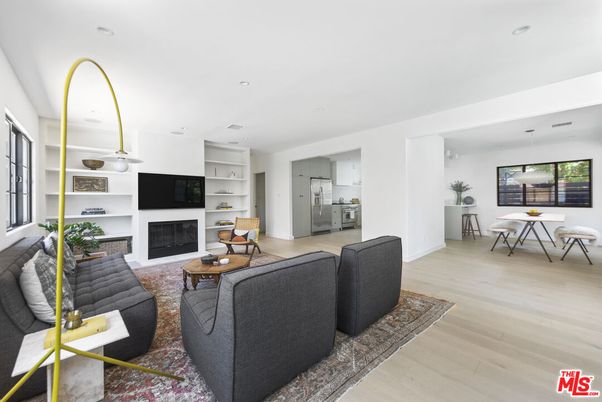 Dining room, Fireplace, Interior, Kitchen, Living room, Pendant Lights, Recessed Lighting, Stainless Steel Appliances, Wood Texture Flooring