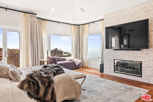 Bedroom, Fireplace, Interior, Stone Walls, Water, Wood Texture Flooring