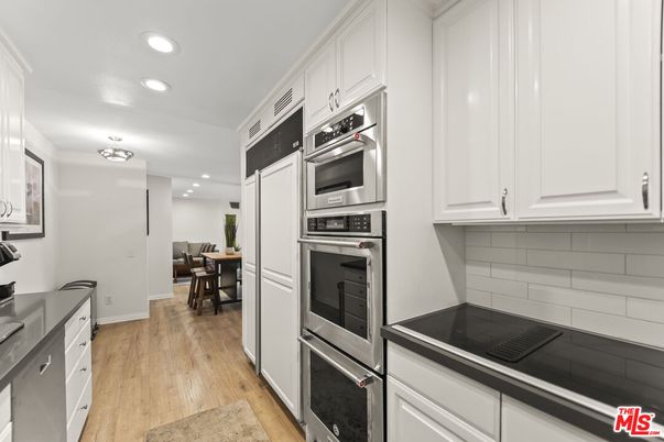 Dining room, Interior, Kitchen, Recessed Lighting, Stainless Steel Appliances, Wood Texture Flooring