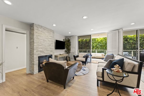 Fireplace, Interior, Living room, Recessed Lighting, Stone Walls, Wood Texture Flooring