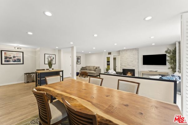 Dining room, Fireplace, Interior, Living room, Recessed Lighting, Wood Texture Flooring
