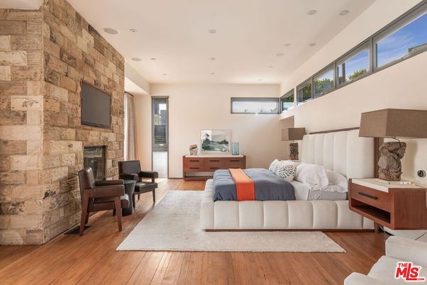 Fireplace, Interior, Living room, Recessed Lighting, Stone Walls, Wood Texture Flooring