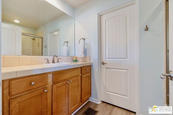 Bathroom, Glass Shower, Interior, Recessed Lighting, Tile Countertops, Wood Texture Flooring