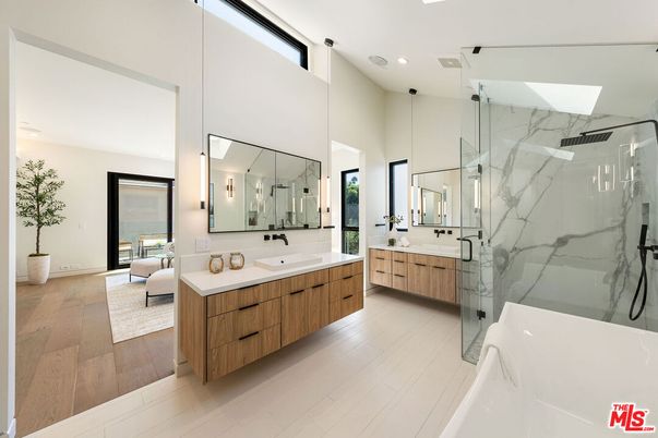 Bathroom, Dual Sink Vanities, Glass Shower, Interior, Marble Walls, Recessed Lighting, Wood Texture Flooring