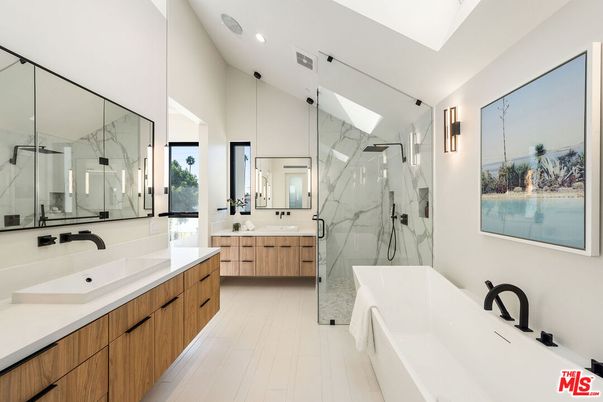 Bathroom, Dual Sink Vanities, Free Standing Baths, Glass Shower, Interior, Marble Walls, Recessed Lighting, Wood Texture Flooring
