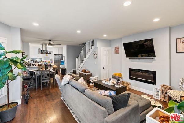 Dining room, Fireplace, Interior, Living room, Recessed Lighting, Wood Texture Flooring