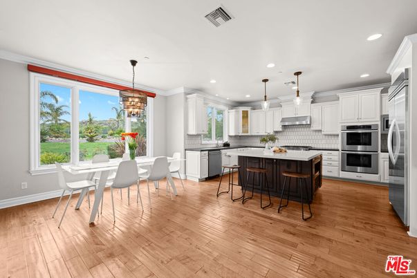 Dining room, Interior, Kitchen, Pendant Lights, Recessed Lighting, Stainless Steel Appliances, Wood Texture Flooring