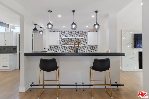 Interior, Kitchen, Marble Walls, Pendant Lights, Recessed Lighting, Wood Texture Flooring