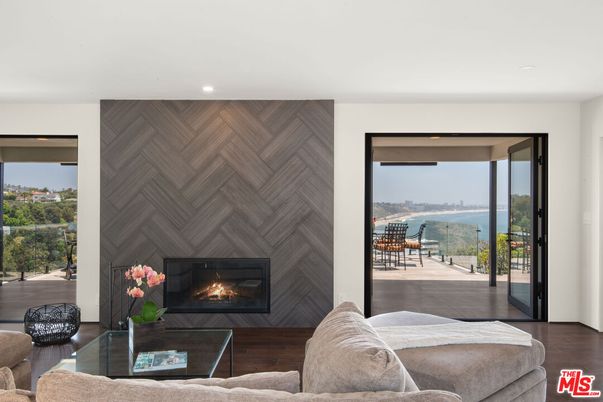 Fireplace, Interior, Living room, Recessed Lighting, Water, Wood Texture Flooring