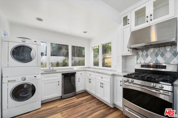 Interior, Kitchen, Recessed Lighting, Stainless Steel Appliances, Washer, Wood Texture Flooring