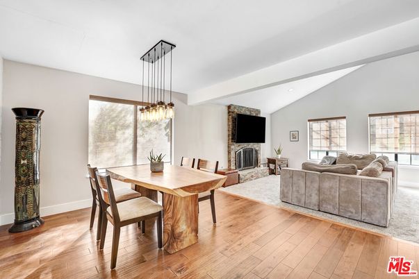 Dining room, Fireplace, Interior, Living room, Pendant Lights, Recessed Lighting, Wood Texture Flooring
