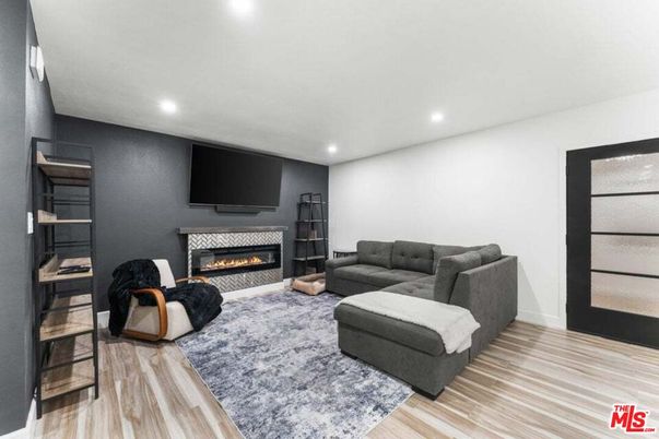 Fireplace, Interior, Living room, Recessed Lighting, Wood Texture Flooring