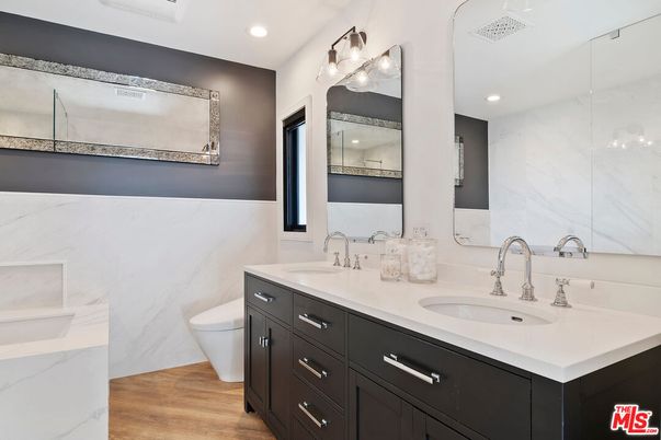 Bathroom, Dual Sink Vanities, Interior, Marble Walls, Recessed Lighting, Wood Texture Flooring