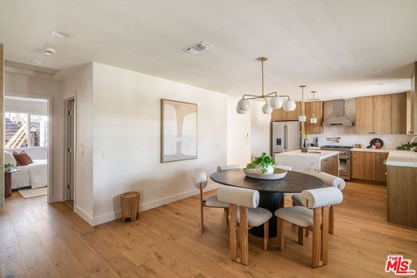 Dining room, Interior, Kitchen, Pendant Lights, Recessed Lighting, Stainless Steel Appliances, Wood Texture Flooring