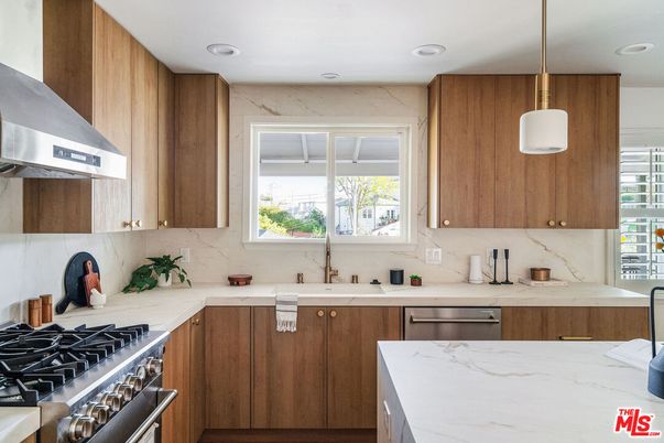 Interior, Kitchen, Marble Walls, Pendant Lights, Recessed Lighting, Stainless Steel Appliances