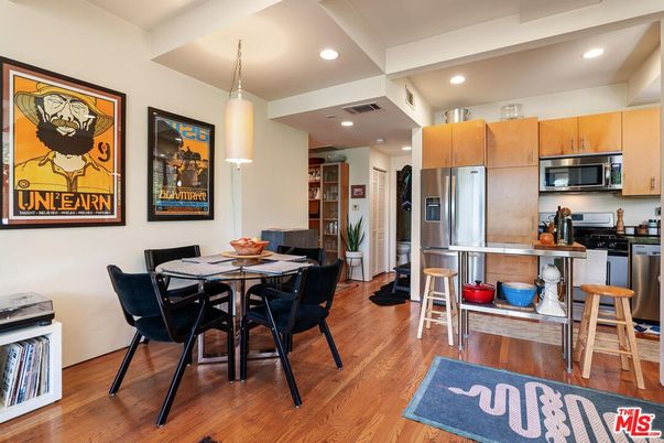 Dining room, Interior, Kitchen, Pendant Lights, Recessed Lighting, Stainless Steel Appliances, Wood Texture Flooring