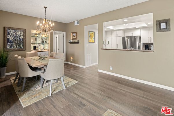 Chandelier, Dining room, Interior, Kitchen, Recessed Lighting, Stainless Steel Appliances, Wood Texture Flooring