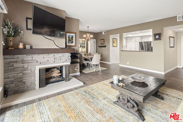 Chandelier, Dining room, Fireplace, Interior, Stone Walls, Wood Texture Flooring