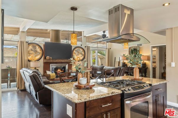 Dining room, Fireplace, Interior, Kitchen, Living room, Pendant Lights, Recessed Lighting, Stainless Steel Appliances, Wood Texture Flooring