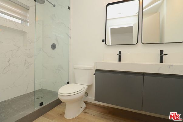 Bathroom, Glass Shower, Interior, Marble Walls, Wood Texture Flooring