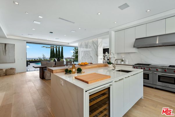 Dining room, Interior, Kitchen, Marble Walls, Pendant Lights, Recessed Lighting, Stainless Steel Appliances, Wood Texture Flooring
