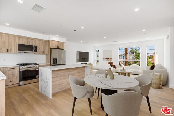Dining room, Interior, Kitchen, Recessed Lighting, Stainless Steel Appliances, Wood Texture Flooring