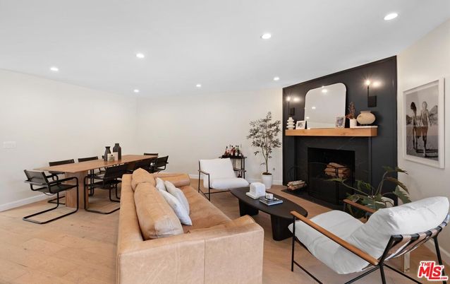 Dining room, Fireplace, Interior, Living room, Recessed Lighting, Wood Texture Flooring