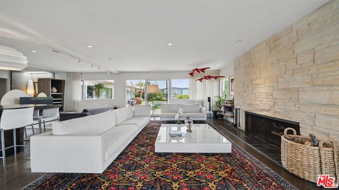 Dining room, Fireplace, Interior, Living room, Recessed Lighting, Stone Walls, Wood Texture Flooring