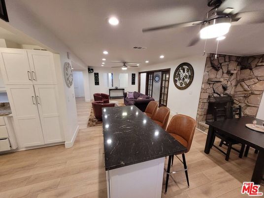 Dining room, Interior, Living room, Recessed Lighting, Stone Walls, Wood Texture Flooring