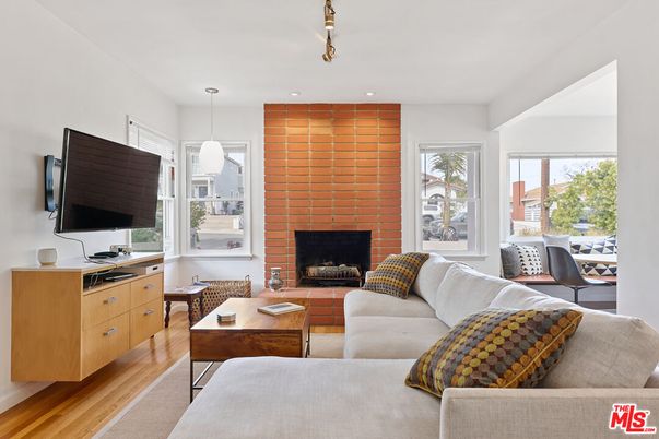 Fireplace, Interior, Living room, Pendant Lights, Recessed Lighting, Stone Walls, Wood Texture Flooring