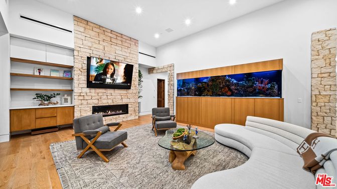 Fireplace, Interior, Living room, Recessed Lighting, Stone Walls, Wood Texture Flooring