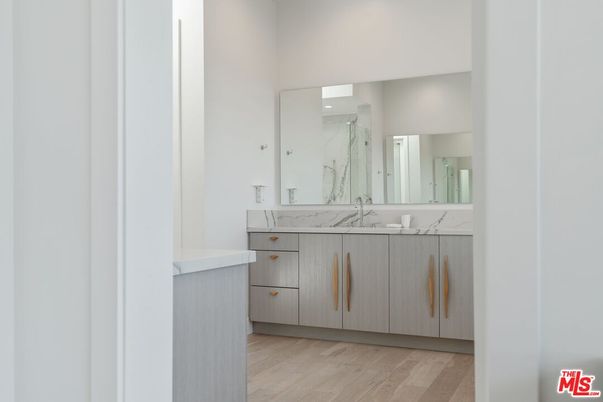 Bathroom, Dual Sink Vanities, Interior, Recessed Lighting, Wood Texture Flooring