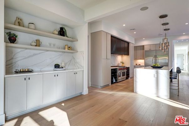 Interior, Kitchen, Marble Walls, Pendant Lights, Recessed Lighting, Stainless Steel Appliances, Wood Texture Flooring