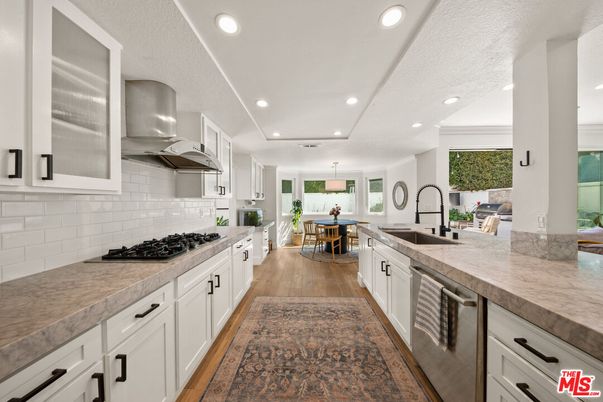 Dining room, Interior, Kitchen, Pendant Lights, Recessed Lighting, Stainless Steel Appliances, Wood Texture Flooring