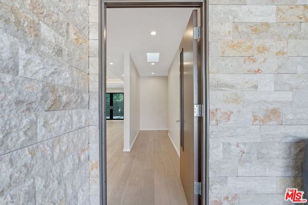 Elevator, Interior, Recessed Lighting, Stone Walls, Wood Texture Flooring